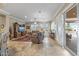 A large living room with tile floors, plush furniture, and lots of natural light at 12839 W Rincon Ct, Sun City West, AZ 85375