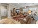 Cozy living room with a large entertainment center, comfortable seating, and stylish rug at 12839 W Rincon Ct, Sun City West, AZ 85375