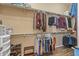 Well-organized walk-in closet with shelves and hanging racks at 12839 W Rincon Ct, Sun City West, AZ 85375