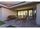 Charming covered patio with comfortable seating, perfect for outdoor relaxation and entertaining at 14372 W Aster Dr, Surprise, AZ 85379