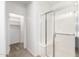 Bathroom with glass-enclosed shower and a view towards the walk-in closet at 14372 W Aster Dr, Surprise, AZ 85379