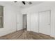 Bedroom featuring a ceiling fan, closet with sliding doors, and an open doorway at 14372 W Aster Dr, Surprise, AZ 85379