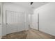 Bedroom with carpet, closet with sliding doors, and a view into the hallway at 14372 W Aster Dr, Surprise, AZ 85379