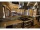 Spacious community room featuring a full kitchen, dining tables, and a projector screen, perfect for social gatherings and events at 14372 W Aster Dr, Surprise, AZ 85379