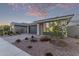 Picture of a lovely single-story home with a two-car garage and desert landscaping for simple upkeep at 14372 W Aster Dr, Surprise, AZ 85379