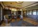 Inviting lobby with wood floors, decorative seating, and well-stocked bookshelves, creating a cozy and refined community space at 14372 W Aster Dr, Surprise, AZ 85379