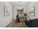 Bright and airy office with a large window, modern desk, and comfortable seating at 14372 W Aster Dr, Surprise, AZ 85379
