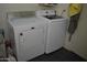 Convenient laundry area featuring a white Samsung washer and Maytag dryer for efficient home care at 1439 W 6Th Dr, Mesa, AZ 85202