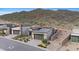 Modern home with desert landscaping and mountain views featuring glass garage door and stylish facade at 14455 N Adero Canyon Dr, Fountain Hills, AZ 85268