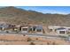 Desert neighborhood with modern homes nestled in the mountains under a clear blue sky at 14455 N Adero Canyon Dr, Fountain Hills, AZ 85268