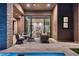 Inviting outdoor patio with comfortable seating and seamless transition to the interior living space at 14455 N Adero Canyon Dr, Fountain Hills, AZ 85268