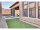 Modern backyard featuring a pool, grass, and brick walls for added privacy at 14455 N Adero Canyon Dr, Fountain Hills, AZ 85268