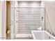 Bright bathroom featuring a modern shower, sleek fixtures, and a tiled design at 14455 N Adero Canyon Dr, Fountain Hills, AZ 85268