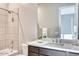 Neutral-toned bathroom with a combined tub and shower, plus a dark wood vanity with a white countertop at 14455 N Adero Canyon Dr, Fountain Hills, AZ 85268