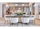 Elegant dining room with modern furnishings, a view of the kitchen, and stylish decor at 14455 N Adero Canyon Dr, Fountain Hills, AZ 85268