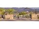 View of the community entrance gate with stone columns and mountain views at 14455 N Adero Canyon Dr, Fountain Hills, AZ 85268