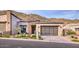Charming single-Gathering home with modern garage door and well-kept landscaping at 14455 N Adero Canyon Dr, Fountain Hills, AZ 85268