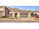 Attractive modern home with desert landscaping and a three car garage at 14455 N Adero Canyon Dr, Fountain Hills, AZ 85268