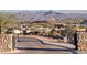 Picturesque gated community entrance with stone accents and stunning mountain backdrop at 14455 N Adero Canyon Dr, Fountain Hills, AZ 85268