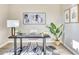 Bright home office with stylish décor, modern desk and chair, and wood-look floors at 14455 N Adero Canyon Dr, Fountain Hills, AZ 85268