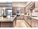 Spacious kitchen featuring a large island with a marble countertop and stainless steel appliances at 14455 N Adero Canyon Dr, Fountain Hills, AZ 85268