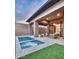 Luxurious backyard features a pristine pool with outdoor seating area for entertaining at 14455 N Adero Canyon Dr, Fountain Hills, AZ 85268