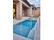 Inviting pool with stone surround and outdoor living space with desert mountain views at 14455 N Adero Canyon Dr, Fountain Hills, AZ 85268