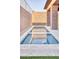 Modern backyard pool with stylish stonework and landscaping at 14455 N Adero Canyon Dr, Fountain Hills, AZ 85268