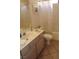 Tiled bathroom featuring a single sink vanity, white toilet, and shower with a patterned curtain at 14462 N Sherwood Dr # B, Fountain Hills, AZ 85268