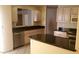 Kitchen showcases stainless steel dishwasher, black countertops, and stylish cabinetry at 14462 N Sherwood Dr # B, Fountain Hills, AZ 85268