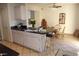 Eat-in kitchen features tile floors, breakfast bar, and adjacent dining area at 14462 N Sherwood Dr # B, Fountain Hills, AZ 85268