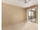 Bright bedroom with light carpet, ceiling fan, and a sliding glass door leading to a patio at 15252 N 100Th St # 1151, Scottsdale, AZ 85260