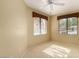 Cozy bedroom with neutral decor, carpet flooring, and large windows providing natural light at 15252 N 100Th St # 1151, Scottsdale, AZ 85260