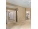 Open bedroom featuring neutral walls, carpet, and entryways to bathroom and hallway at 15252 N 100Th St # 1151, Scottsdale, AZ 85260