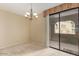 Dining room with sliding glass door providing view to the outside at 15252 N 100Th St # 1151, Scottsdale, AZ 85260