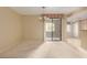 Dining area with chandelier lighting and a view of outdoor patio through sliding door at 15252 N 100Th St # 1151, Scottsdale, AZ 85260