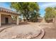 A spacious backyard featuring a covered patio and potential landscaping opportunities at 16510 W Baden Ave, Goodyear, AZ 85338