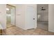 Bathroom showcasing a shower and a door to the main bedroom at 16510 W Baden Ave, Goodyear, AZ 85338