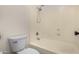 Bathroom featuring a toilet and a tub/shower combination with white walls at 16510 W Baden Ave, Goodyear, AZ 85338