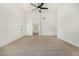 Spacious carpeted bedroom featuring a ceiling fan and lots of natural light at 16510 W Baden Ave, Goodyear, AZ 85338