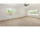 Bright bedroom with large windows and soft carpet at 16510 W Baden Ave, Goodyear, AZ 85338