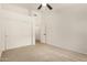 Bedroom featuring neutral carpet, ceiling fan, and a double door closet at 16510 W Baden Ave, Goodyear, AZ 85338