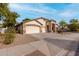 A charming single-story home featuring a three-car garage and desert landscaping at 16510 W Baden Ave, Goodyear, AZ 85338