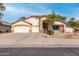 A charming single-story home featuring a three-car garage and desert landscaping at 16510 W Baden Ave, Goodyear, AZ 85338