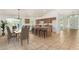 Well-lit kitchen with a central island, bar seating, and an adjacent dining area for Gathering meals at 16510 W Baden Ave, Goodyear, AZ 85338