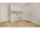 Laundry room with tile flooring, storage shelf, and washer/dryer hookups at 16510 W Baden Ave, Goodyear, AZ 85338