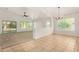 Open-concept living and dining area features carpet and tile floors with ample natural light at 16510 W Baden Ave, Goodyear, AZ 85338