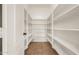 Organized walk-in pantry with ample shelving space, providing convenient storage for groceries and kitchen essentials at 16510 W Baden Ave, Goodyear, AZ 85338