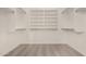 Walk-in closet with built-in shelving and lots of storage space at 16510 W Baden Ave, Goodyear, AZ 85338