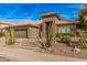 Charming single-story home with desert landscaping, a tile roof, and an attached garage at 1668 E Saltsage Dr, Phoenix, AZ 85048